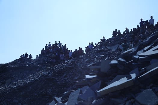 Silhouette of people on hill