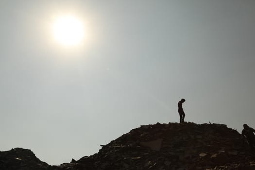 Silhouette of people on hill