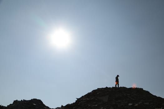 Silhouette of people on hill