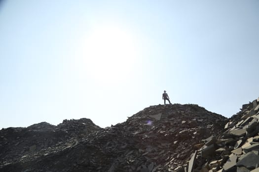 Silhouette of people on hill