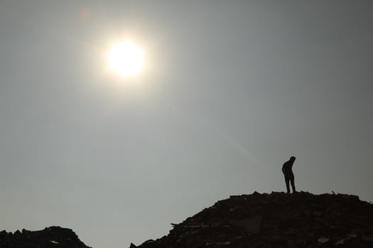 Silhouette of people on hill