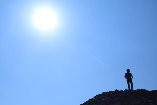 Silhouette of people on hill