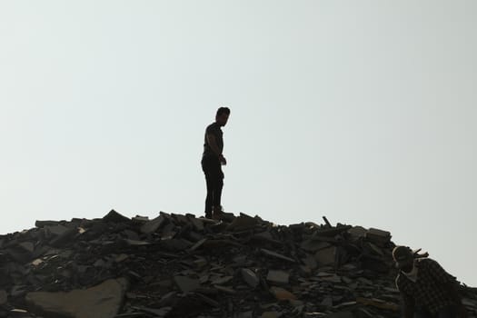 Silhouette of people on hill