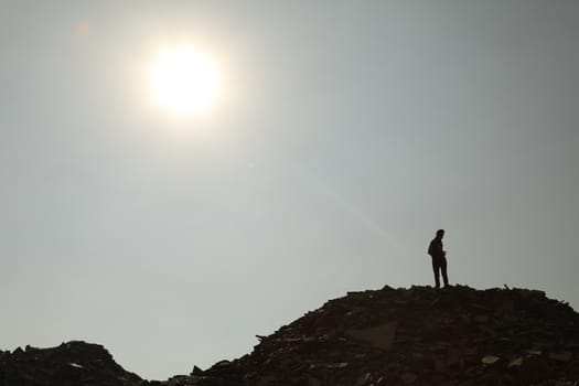 Silhouette of people on hill