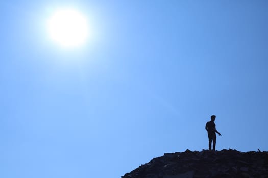 Silhouette of people on hill
