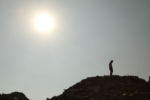 Silhouette of people on hill