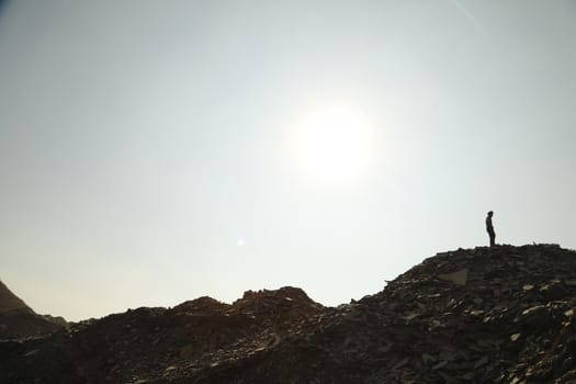 Silhouette of people on hill