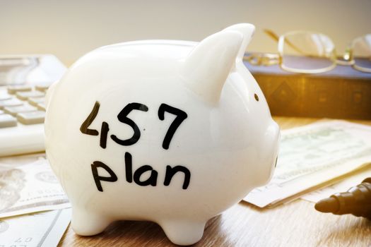 Retirement plan. 457 plan written on a side of piggy bank.