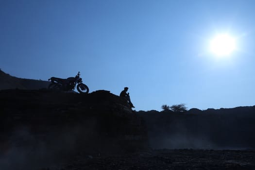 Silhouette of people on hill