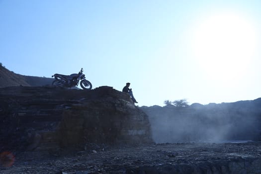 Silhouette of people on hill