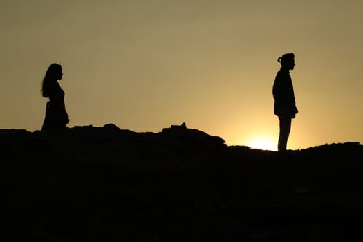 Silhouette of people on hill