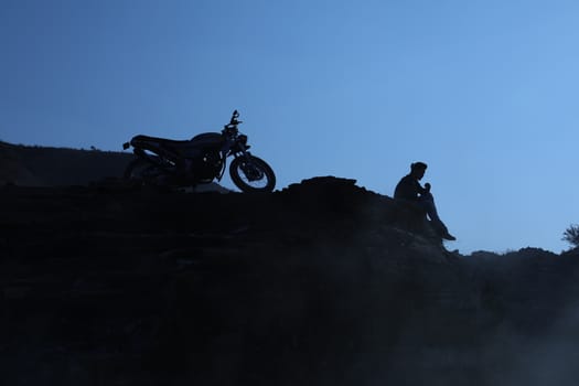 Silhouette of people on hill