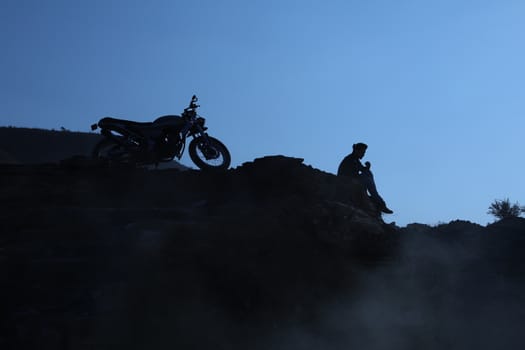 Silhouette of people on hill