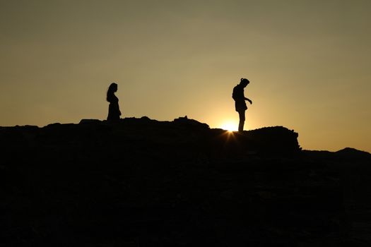Silhouette of people on hill