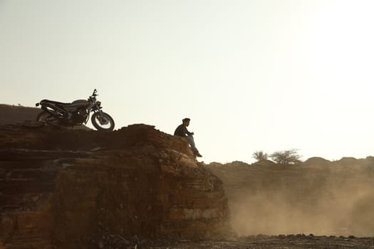 Silhouette of people on hill