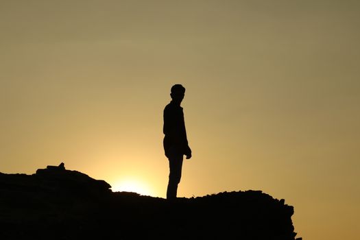 Silhouette of people on hill