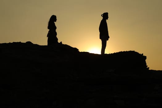 Silhouette of people on hill