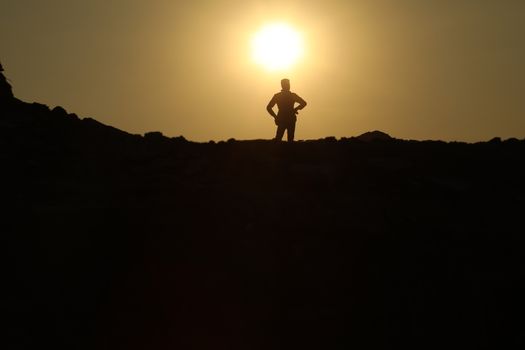 Silhouette of people on hill