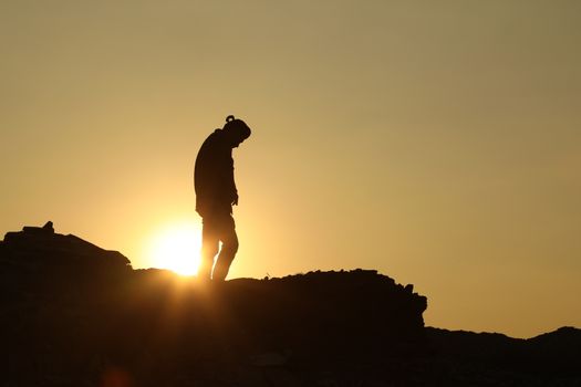 Silhouette of people on hill
