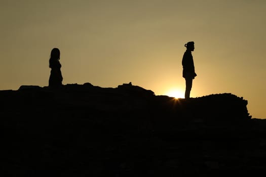 Silhouette of people on hill