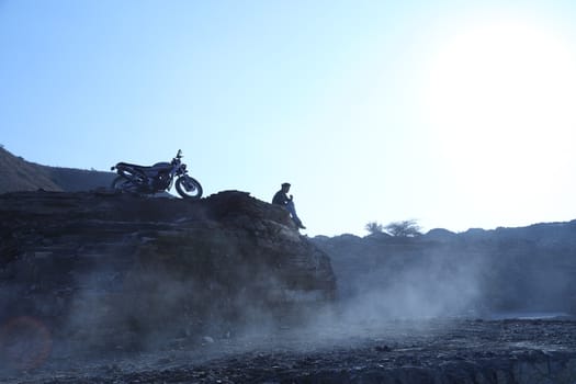 Silhouette of people on hill