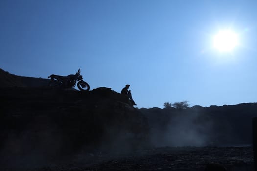 Silhouette of people on hill