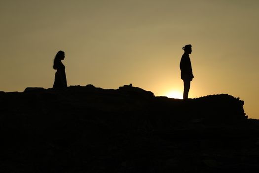 Silhouette of people on hill