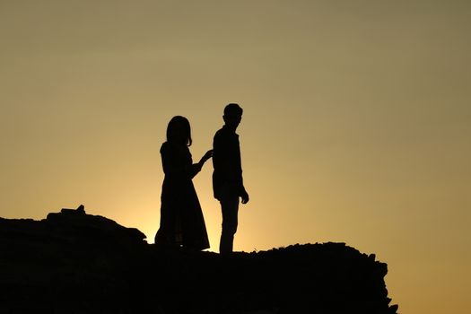 Silhouette of people on hill
