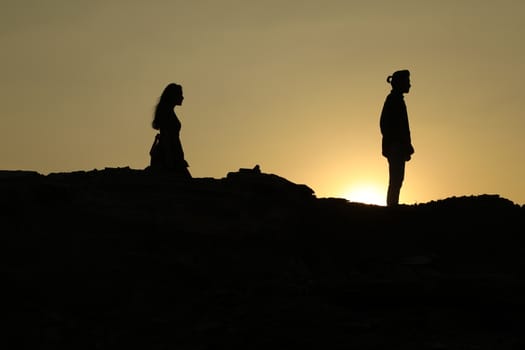 Silhouette of people on hill