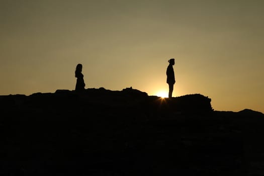 Silhouette of people on hill
