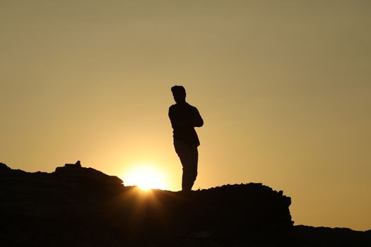 Silhouette of people on hill