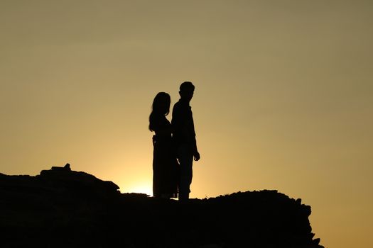 Silhouette of people on hill