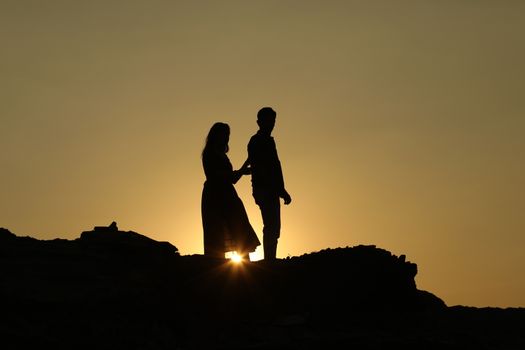 Silhouette of people on hill