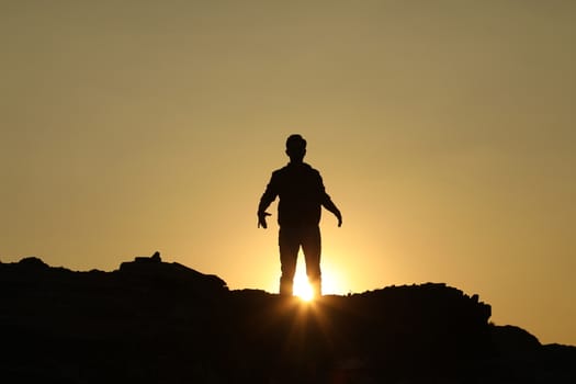 Silhouette of people on hill