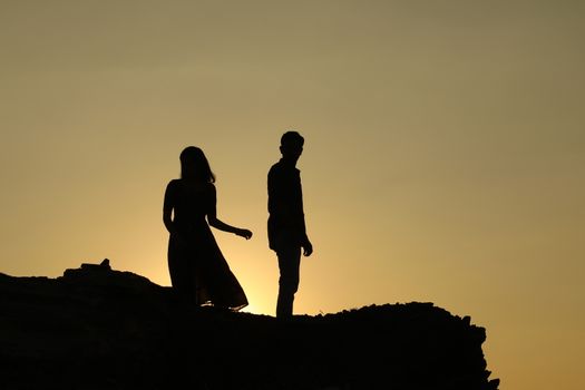 Silhouette of people on hill