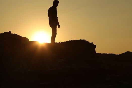 Silhouette of people on hill
