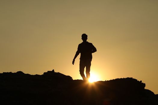 Silhouette of people on hill