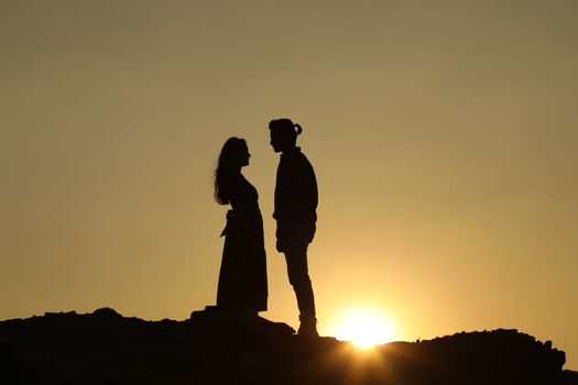 Silhouette of people on hill