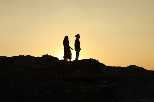 Silhouette of people on hill