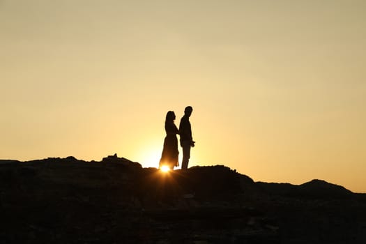 Silhouette of people on hill