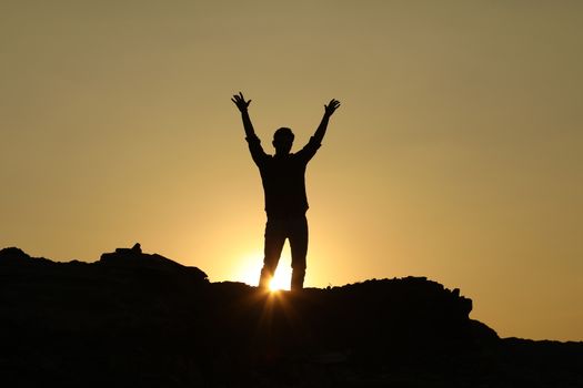 Silhouette of people on hill