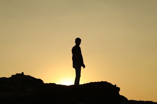 Silhouette of people on hill