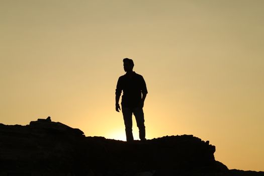 Silhouette of people on hill