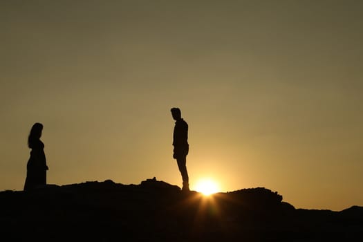 Silhouette of people on hill
