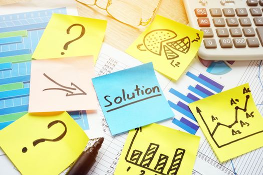 Question marks and arrows to word solution. Solving of problems in business.