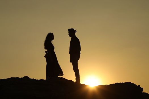 Silhouette of people on hill