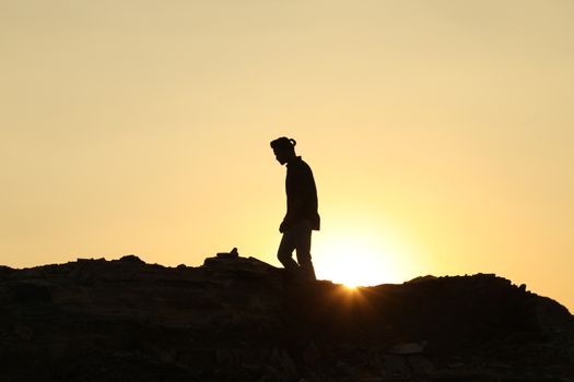 Silhouette of people on hill