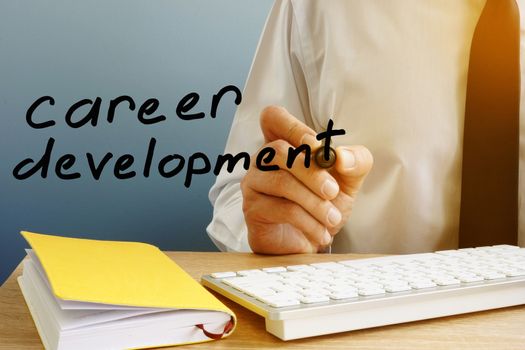 Career development. Man at the office table.