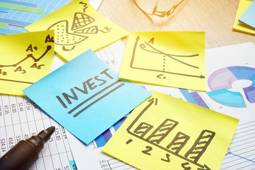 Word invest and financial charts. Return on investment.