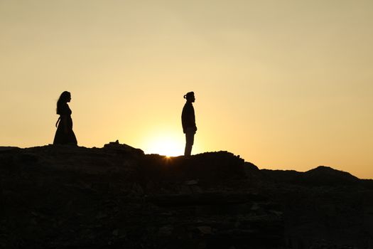 Silhouette of people on hill